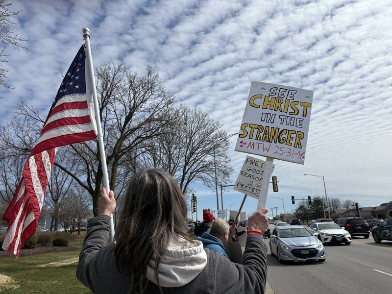 Attendees line Route 14 at a No Kings rally in Crystal Lake, Saturday, March 28, 2026.