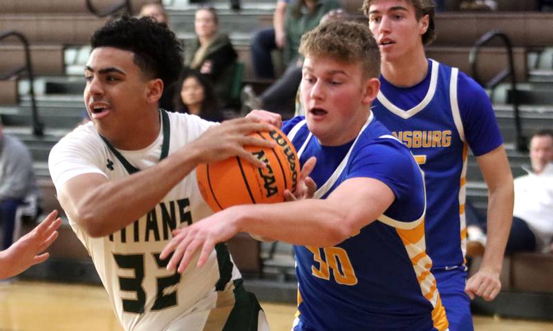 Johnsburg’s Jayce Schmitt, right, guards Boylan’s Christian Kennedy in varsity boys basketball Hinkle Holiday Classic action on Tuesday, Dec. 23, 2025, at Jacobs High School in Algonquin.