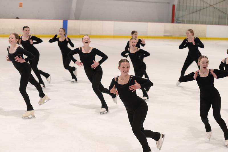 Members of the Dazzlers synchronized skating team prepare for an upcoming performance Wednesday Feb 15, 2023.
