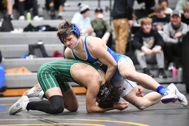 Central-Iroquois West's Gianni Panozzo wrestles Bishop McNamara's Trevor Torres during Panozzo's 150-pound first round victory on Saturday, Feb. 8, 2025, in the IHSA Class 1A Herscher regional.