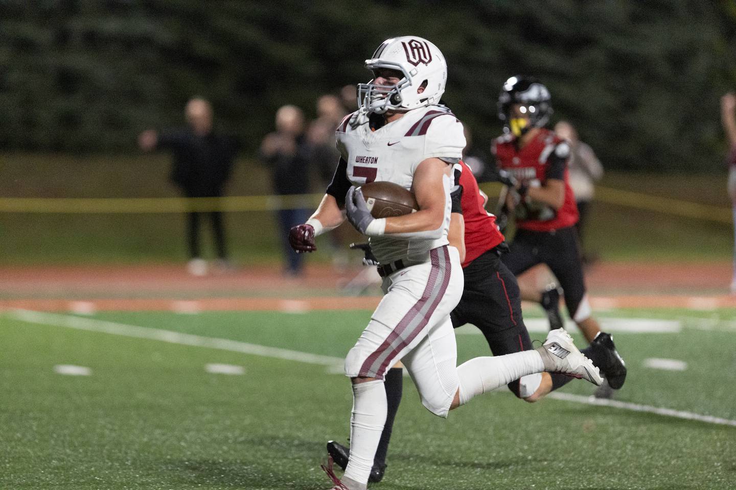 Wheaton Academy's Ethan Brooks runs the ball for a gain against Aurora Christian on Friday, Oct. 17,2025 in Aurora.