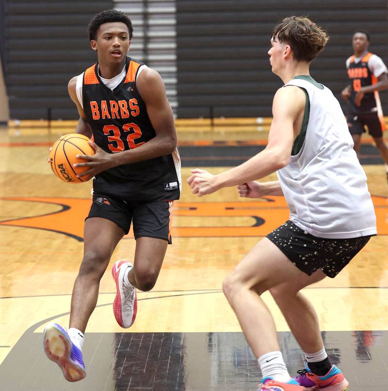 DeKalb’s Justin O'Neal drives down the lane during their summer game against Elk Grove Tuesday, June 18, 2024, at DeKalb High School.