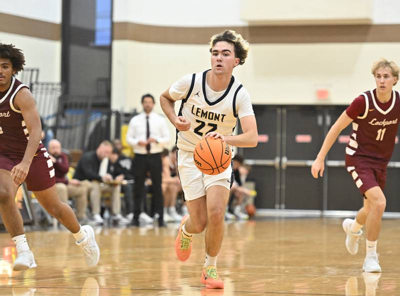 Lemont's Zane Schneider brings the ball up the court during the WJOL tournament championship game against Lockport on Saturday, NOV. 29, 2025, at Joliet.