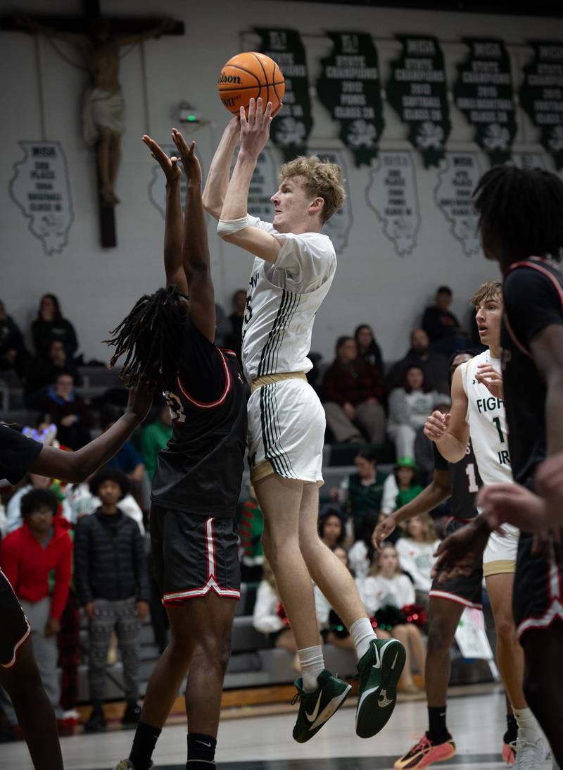 Bishop McNamara's Richie Darr elevates for a shot as Chicago Bulls Prep's Amil Baker, left, guards in a game on Friday, December 19, 2025.