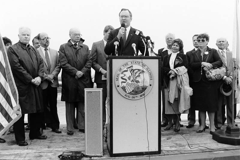 Former Illinois Gov. Jim Thompson speaks to a crowd of people gather during the grand opening of the Illinois Valley Regional Airport on Friday, Oct. 18, 1985 in Peru