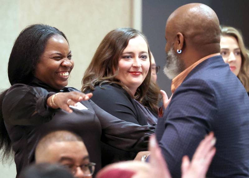 Tiffany Tucker and LaBrian Carrington from Building Leaders Advocating for Change hug after hearing their name announced as the 2023 Nonprofit Organization Award recipient Thursday, Feb. 8, 2024, during the DeKalb Chamber of Commerce’s Annual Celebration Dinner in the Barsema Alumni and Visitors Center at Northern Illinois University.