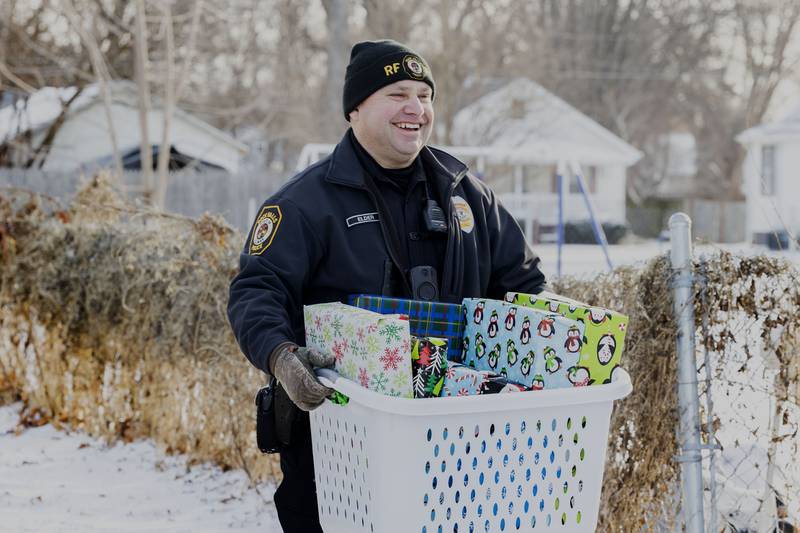 Rock Falls officer Rollie Elder channels his own inner Santa Saturday, Dec. 24, 2022 to deliver some Christmas cheer to a local family.