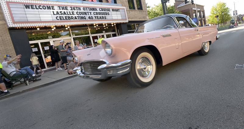 A 57 Ford Thunderbird cruises down LaSalle St in Ottawa Friday during the 26th annual Ottawa Cruise Night.