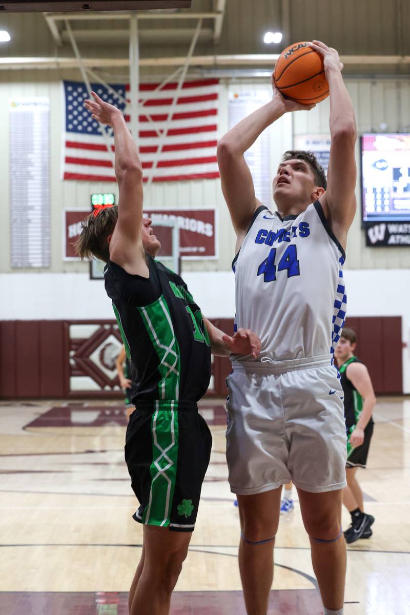 Clifton Central's Conner Unger goes for a layup under pressure from Bishop McNamara's Coen Demack during the Fightin' Irish's 62-41 victory in the Watseka Holiday Tournament championship on Tuesday, Dec. 16, 2025.