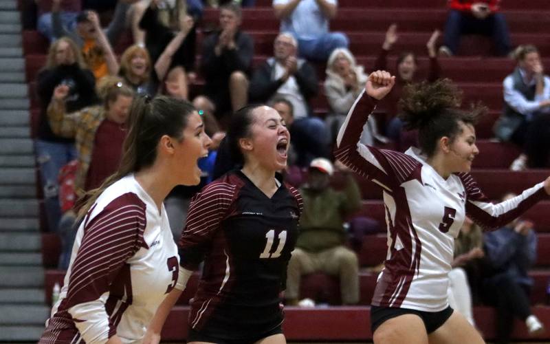 Marengo’s Marlee Gordon, right, Abigail Paiz, center, and Leila Becovic celebrate a second-set win over Marian Central in IHSA Class 2A  Regional volleyball action on Monday, Oct. 28, 2024, at  Marengo High School  in Marengo. The host Indians eventually fell in three sets to the Hurricanes.