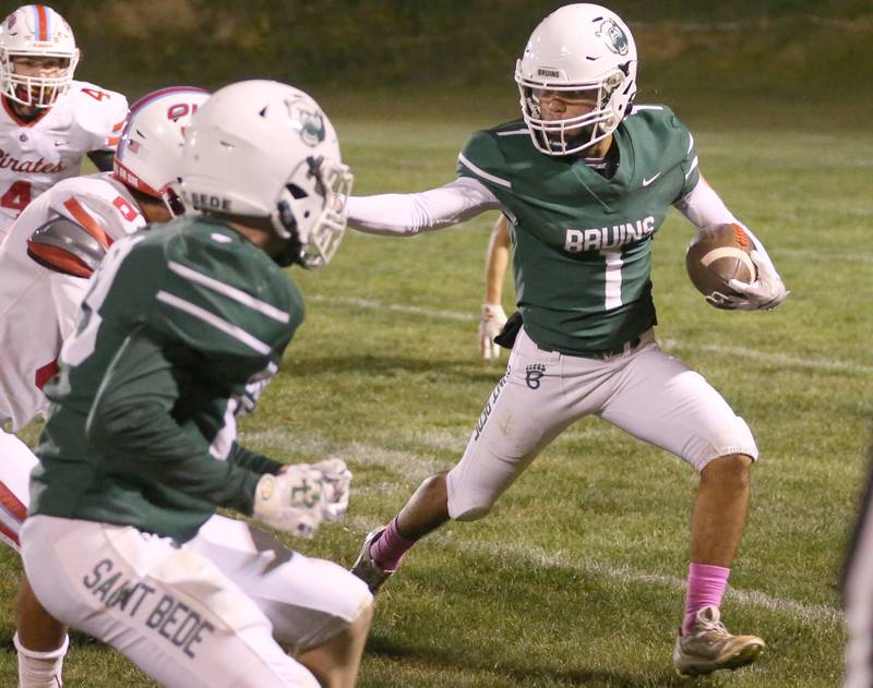 St. Bede's Jose DeLaTorre stiff arms Ottawa on Friday, Oct. 25, 2024 at St. Bede Academy.