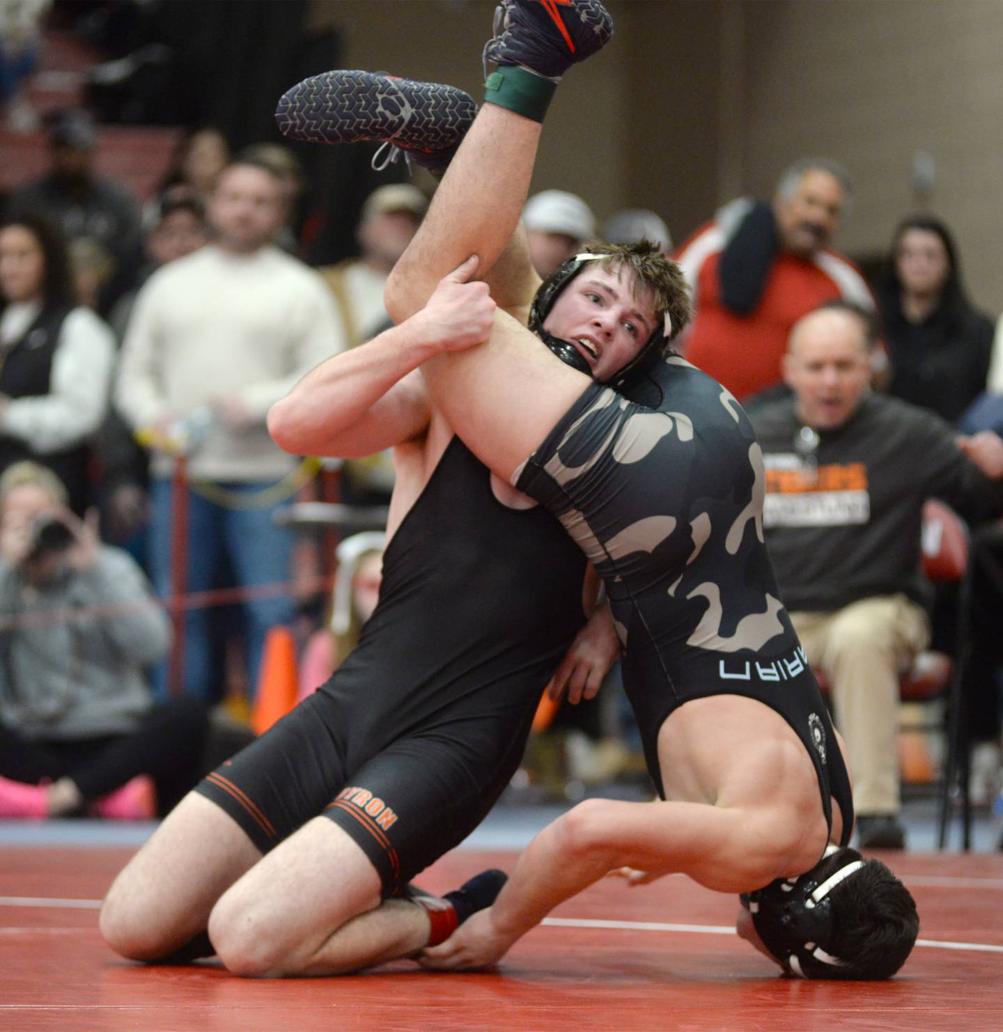 Byron’s Brody Stein flips Woodstock Marian’s Nic Astacio during their 165-pound match at the 1A Oregon Sectional on Friday, Feb. 14, 2025.
