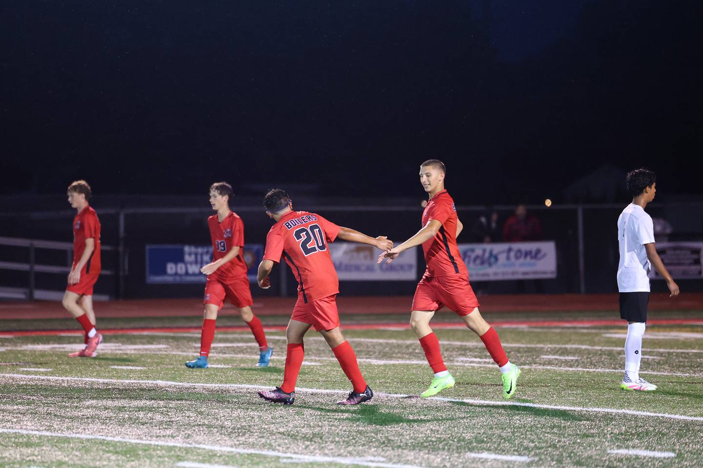 Bradley-Bourbonnais' John Sadulla is high-fived by teammate Abram Mikhaiel after scoring one of his three goals during the Boilermakers' 9-0 victory over Bishop McNamara in an All-City match up on Wednesday, Sept. 3, 2025.