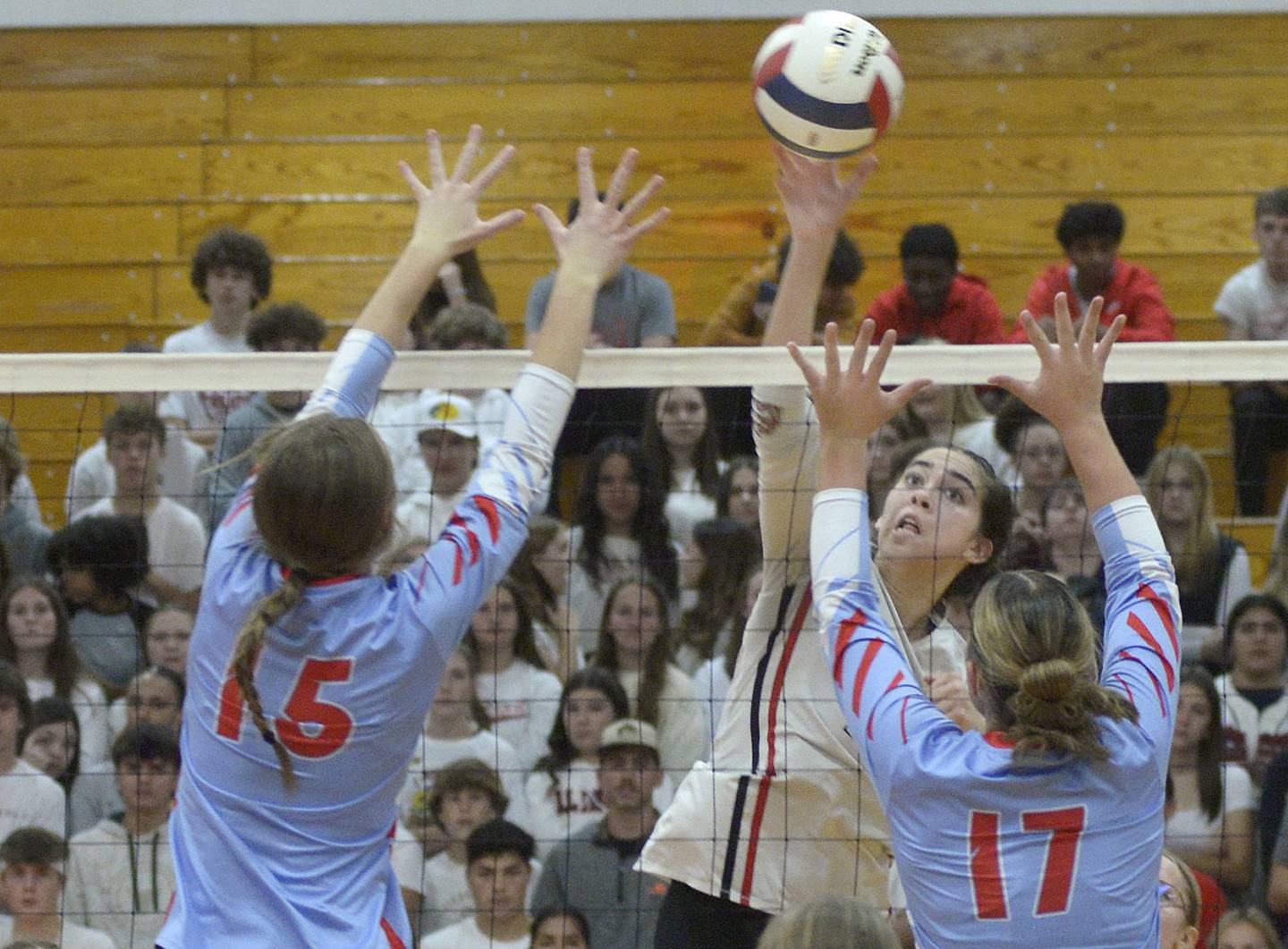 Streator’s Alexa Jacobs prepares a tip while Ottawa’s Addison Duggan and Olivia Evola prepare the block  in the second match Thursday at Streator.