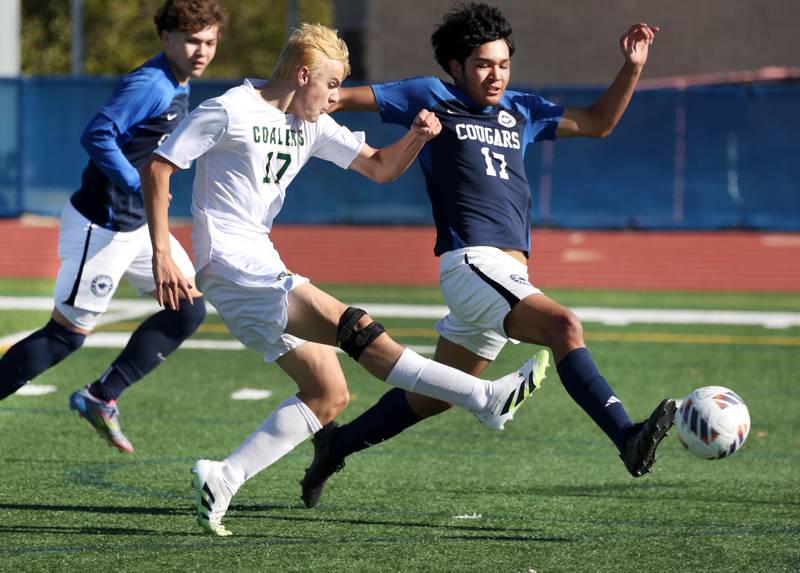 Coal City's Adrian Dames kicks the ball by Chicago Academy's Francisco Marquez for a goal Friday, Nov. 7, 2025, during their Class 1A state third place game at Hoffman Estates High School.