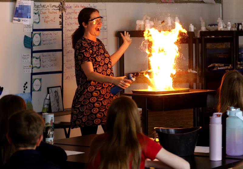 Teacher Ally Eget performs a reaction rate experiment with coffee creamer for her sixth-grade students Monday, May 1, 2023, at Montini Catholic School in McHenry. I love this photo because it was just an absolute blast to photograph.