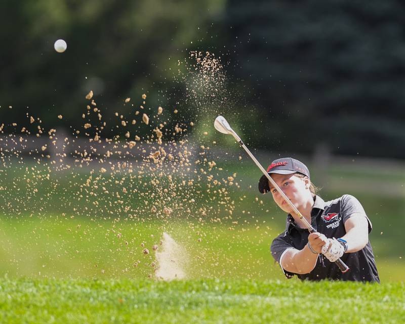 Elaina Newman of Yorkville watches her ball after hitting out of the sand trap during the Southwest Prairie conference meet on Wednesday Sept. 24, 2025, held at Blackberry Oaks Golf course in Bristal.