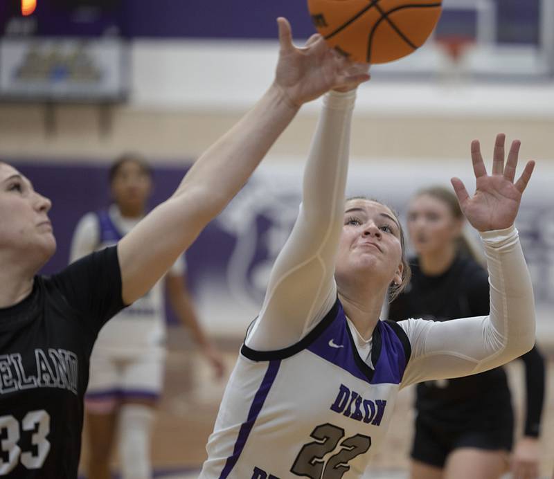 Dixon’s Abby Hicks goes after a loose ball against Kaneland’s Kalie Brown Wednesday, Dec. 10, 2025.