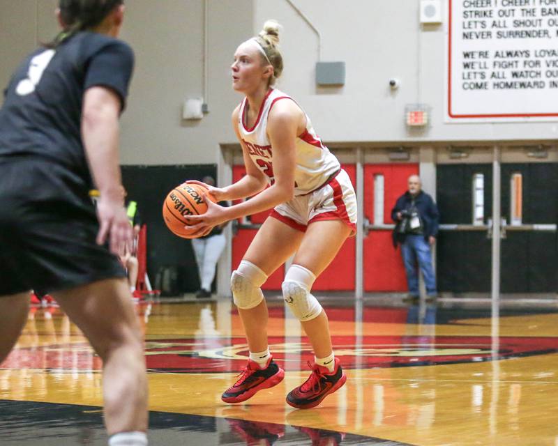 Benet's Bridget Rifenburg (22) gathers to shoot a jumper during their Class 4A Bolingbrook Sectional final basketball game between Waubonsie Valley at Benet. Feb 27, 2025 in Bolingbrook.