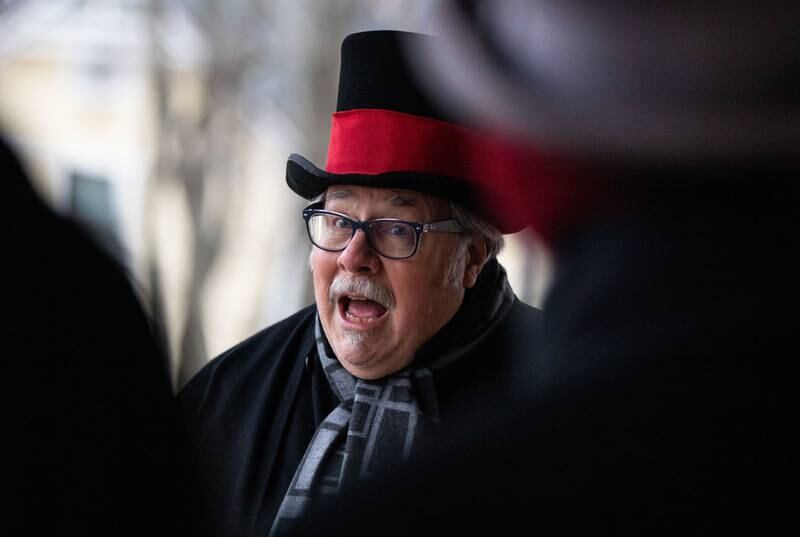 A singer from the Canturbury Carollers performs Christmas carols during a Merry & Bright Victorian Christmas at the Downers Grove Museum on Saturday, Dec. 14, 2024.