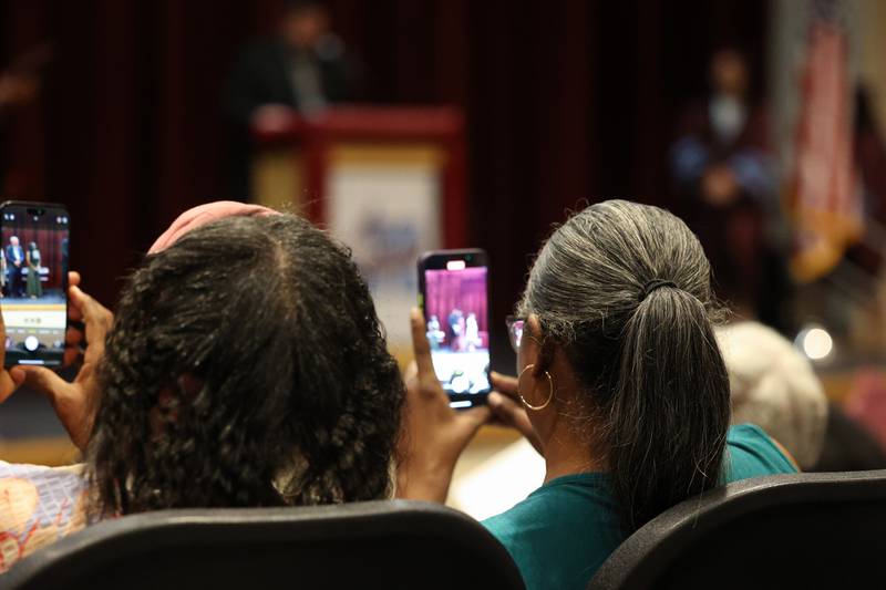 Crowd members take video and photos as Kankakee High School graduates receive their diplomas during the summer commencement ceremony at the high school on Tuesday, July 29, 2025.