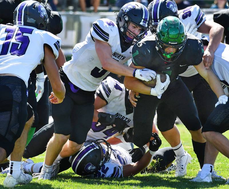 Downers Grove North's Jameson Ordway (3) and a host of his teammates work together to stop Glenbard West's Ben Cesario on a fourth and goal play during a game on Sep. 9, 2023 at Glenbard West High School in Glen Ellyn.
Jon Cunningham for Shaw Local News Network