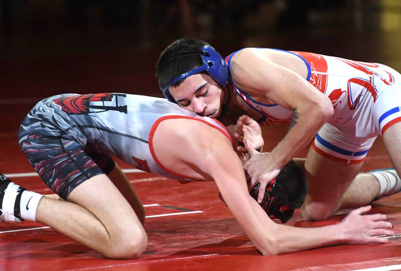 Oregon's Josiah Perez (right) and Fulton's Brady Keller wrestle at 120 pounds at Oregon High School on Thursday, Dec. 4, 2025.