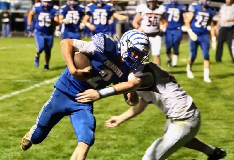 Princeton senior quarterback Teegan Davis makes his way in for a 26-yard touchdown to give the Tigers a 56-0 halftime lead over Kewanee Friday night.