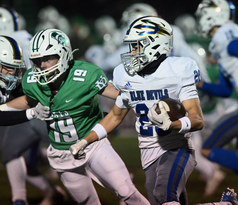 Warren’s Simon Castillo carries the ball against York during a Class 8A football quarterfinal on Friday, Nov. 15, 2024 in Elmhurst.