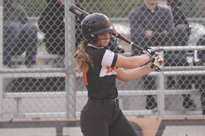 St. Charles East's Sam Gaca (11) singles against Downers Grove South during a softball game at St. Charles East High School on Wednesday, April 10, 2024.