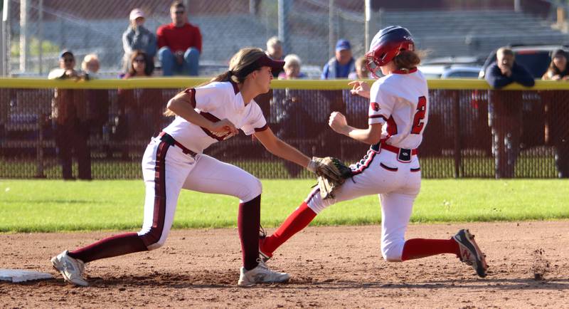 Richmond-Burton’s Mia Spohr, left, tags out Stillman Valley’s Kiera Carow at second base in softball sectional title game action in Richmond Friday evening.
