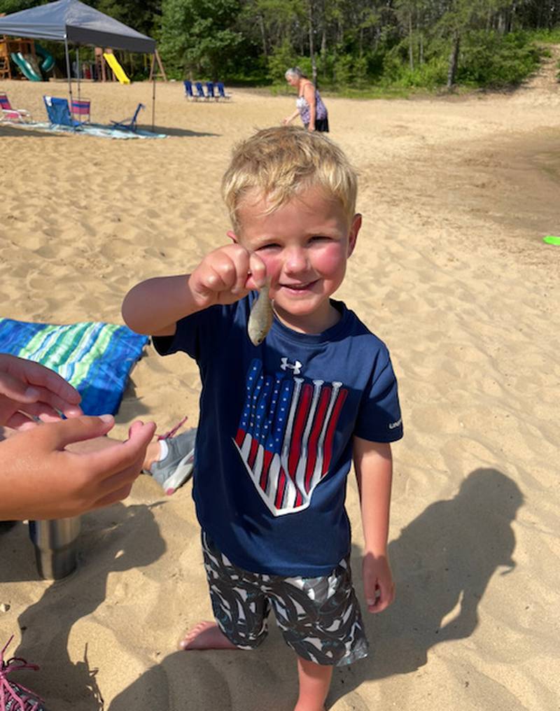 Levi Olson, 4, of Marengo, fishing with his family on July 2, 2022. The left side of Levi's heart did not develop and he is now awaiting a transplant.