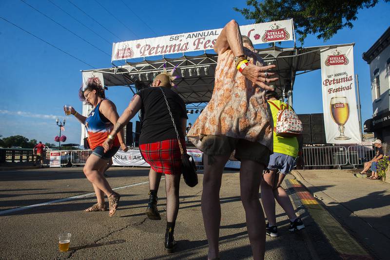 Fans dance to “Sublime” tribute band “Secondhand Smoke” Saturday, July 2, 2022 on the G&M Stella main stage at Dixon’s Petunia Fest.