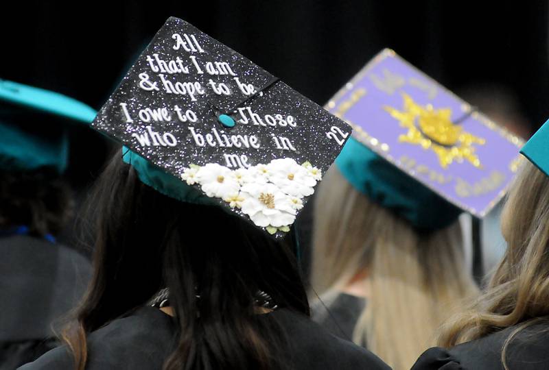 Decorated caps on Saturday, May 14, 2022, during the graduation ceremony at Woodstock North High School.