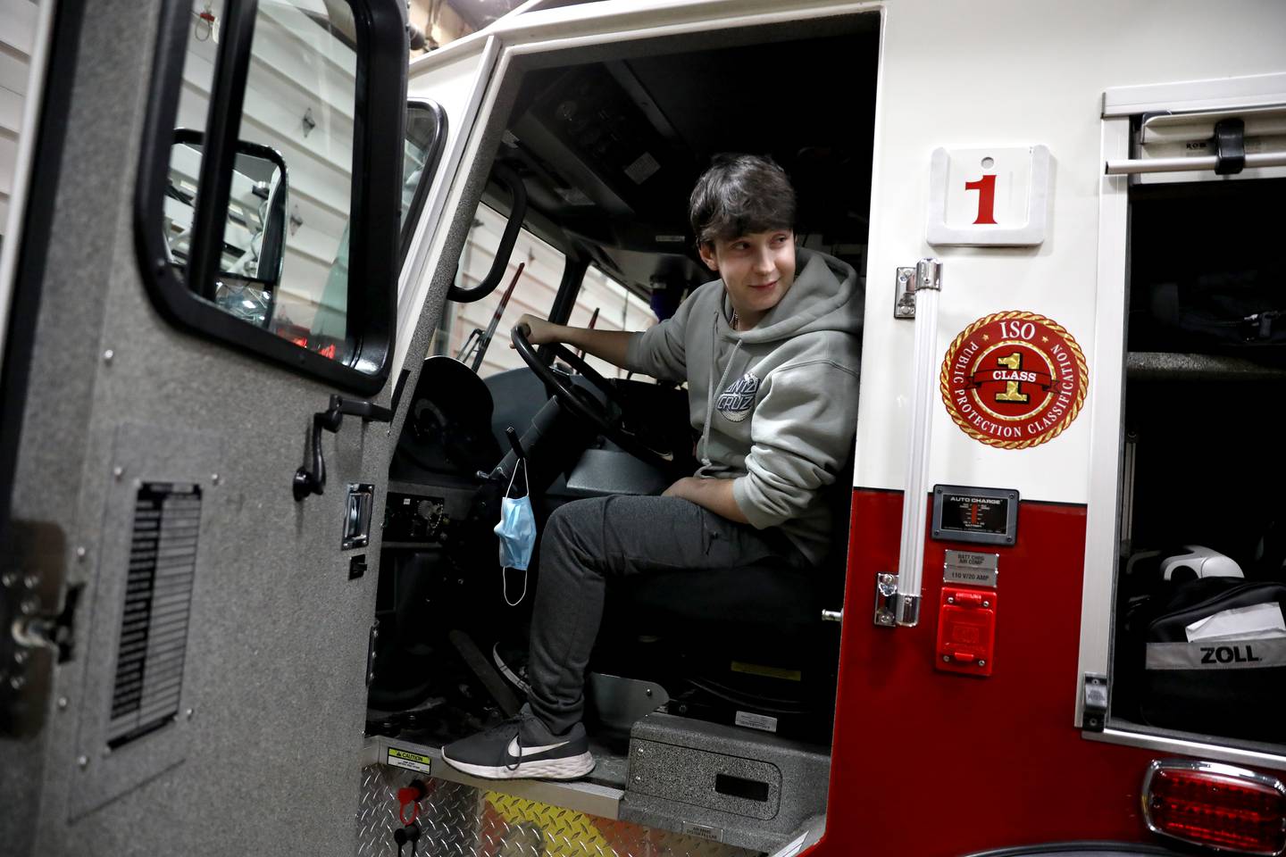 Brice Worley, 16, a junior at Batavia High School, gets a tour of an engine at the Batavia Fire Department’s Wilson Street Station. Worley was born with a brain tumor that was dormant until 2019. He hopes to study to become a paramedic.