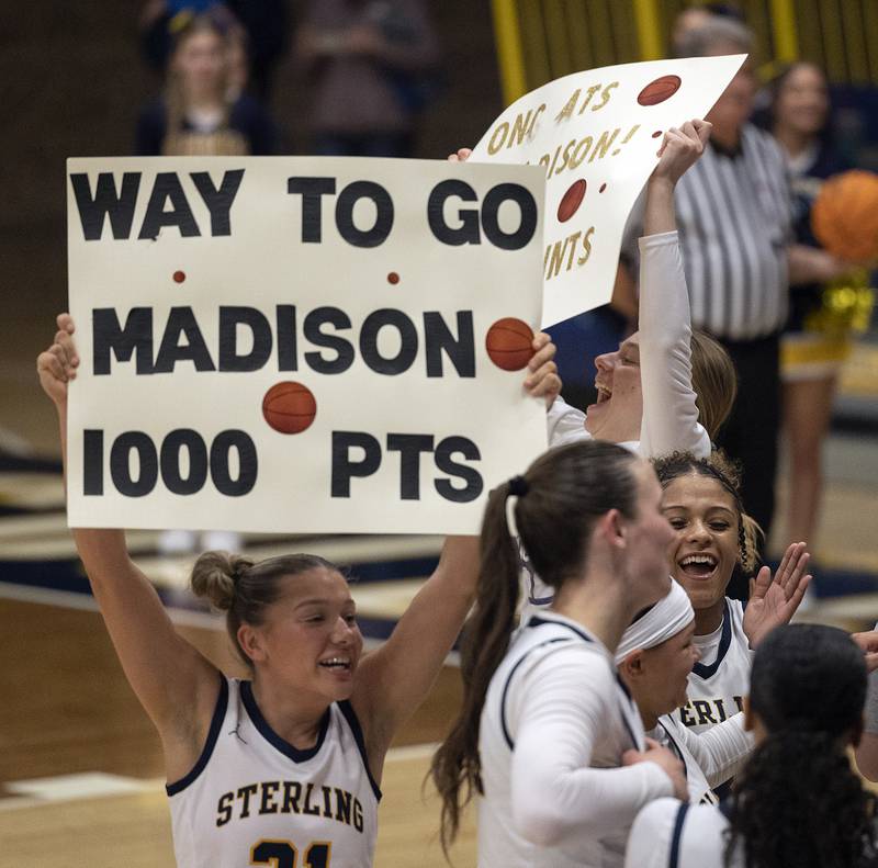 Teammates celebrate Sterling’s Madison Austin after sinking a free throw for her 1,000 career point Monday, Feb. 17, 2025, in a semifinal regional against Rochelle.