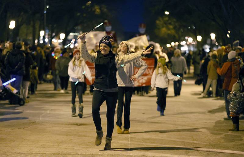 Joy Nelson of Geneva spins her baton during the annual Christmas Walk Friday, Dec. 6, 2024 in Geneva.