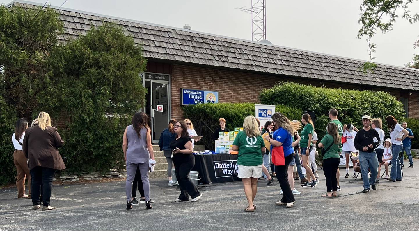 A crowd of a couple dozen gathered outside at  2201 North First Street in DeKalb on June 15, 2023 for the beginning of the Kishwaukee United Way annual Day of Caring event.