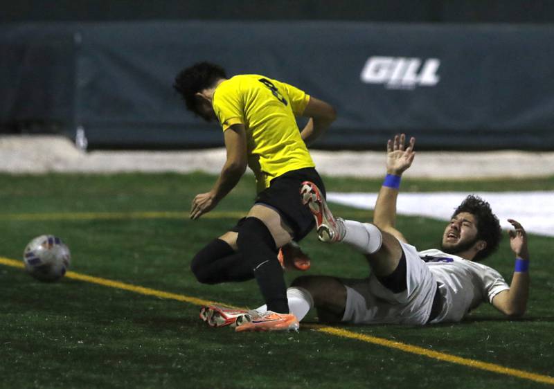 Wauconda's Sam Jurczyk gets tangled with Harvard's Avery Gonzalez as they battle fo the ball during the IHSA Boys Soccer 2A Grayslake Central Sectional semifinal match on Tuesday, Oct. 29, 2024, at Grayslake Central High School,