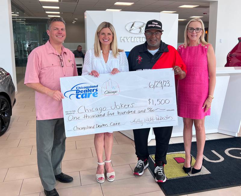 Chicago Automobile Trade Association presents a check for $1,500 to Community Works & Sports Alternatives/Chicago Jokers alongside Pugi Auto Group.