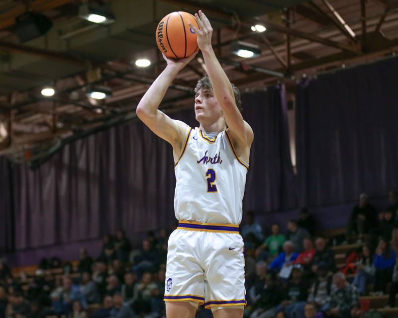 Downers Grove North's Jack Romsey (2) shoots a three during their basketball game between Glenbard West at Downers Grove North. Jan 24, 2025 in Downers Grove.