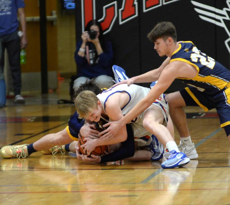 Eastland's Adam Awender fights for a loose ball with Polo players on Friday, Feb. 23, 2024 at the 1A Forreston Regional championship game at Forreston High School.