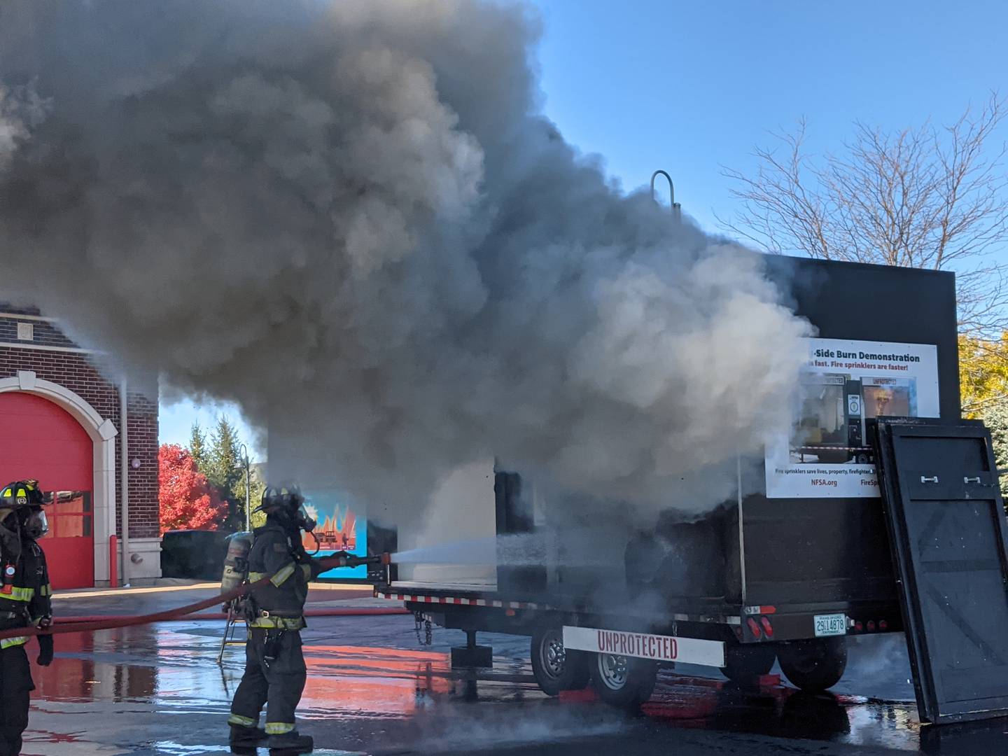 People attending the Oswego Fire and Oswego Police’s annual joint open house on Oct. 26 saw how quickly a fire can spread during a live burn demonstration.
As part of the demonstration, two rooms with smoke alarms were set on fire. One room contains a single fire sprinkler, while the adjoining room does not.
Those watching the demonstration saw how rapidly the fire spread in the room without a fire sprinkler. In the room with the fire sprinkler, the fire is suppressed quickly.