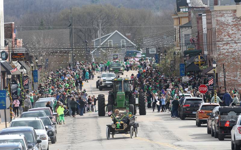 A large crowd of people watch the St. Patrick's Day parade on Saturday, March 16, 2024 downtown Utica.