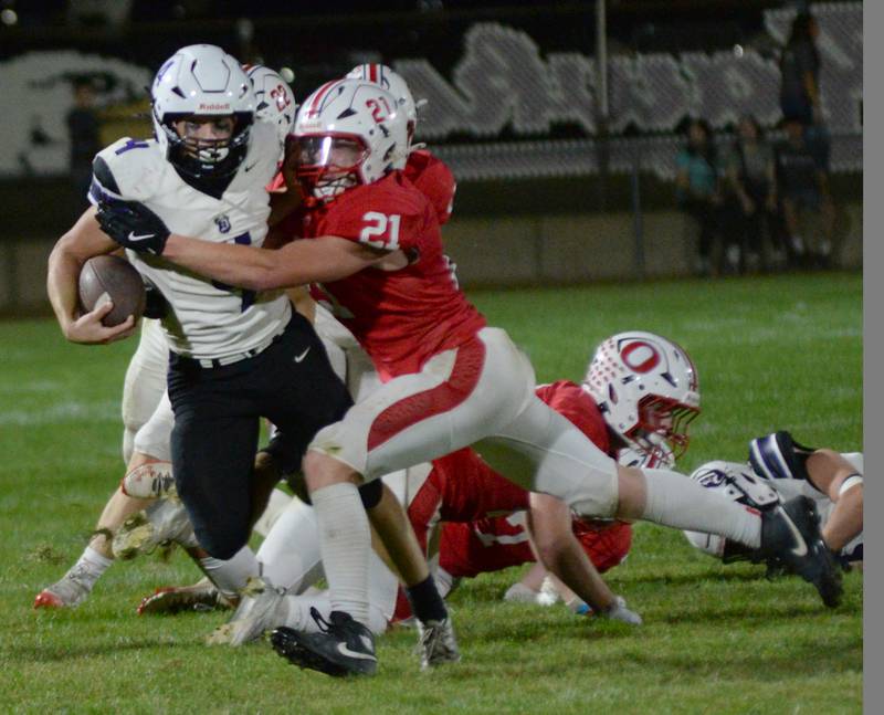 Oregon's Zandyr Withers (21) tackles Dixon's Landon Knigge (4) on Friday, Sept. 26, 2025 at Landers-Loomis Field in Oregon.