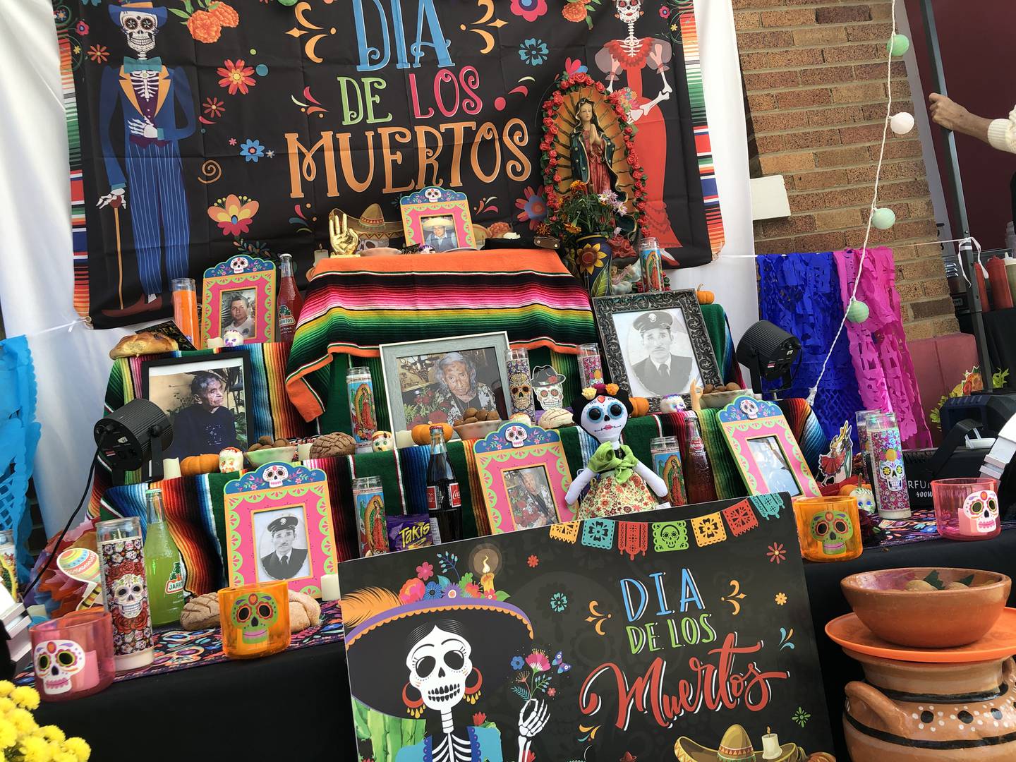 Altars with candles and photos of passed loved ones are a central theme of Día de los Muertos – Day of the Dead – as celebrated by some cultures in the Americas. This altar was part of Harvard's celebration on Saturday, Oct. 18, 2025.