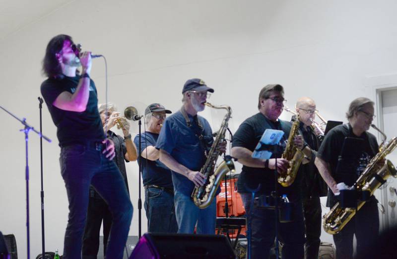 Jeff Anthony sings as the brass section plays during the Brass From The Past performance at the Jamboree Concert Series Friday, Aug. 1, 2025 in Mt. Morris.