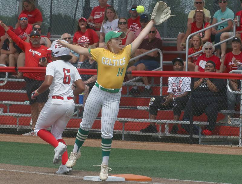 Providence Catholic's Ava Misch misses a catch at first base as Chatham's Hope Gilmore runs through the bag during the Class 3A State finals game on Saturday, June 14, 2025 at the Louisville Slugger Sports Complex in Peoria.