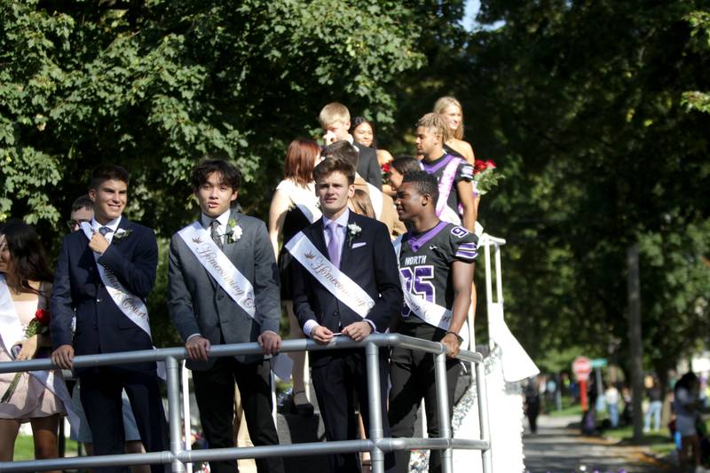 Members of the Downers Grove North Homecoming Court ride on a float during the school’s annual homecoming parade on Friday, Sept. 29, 2023.