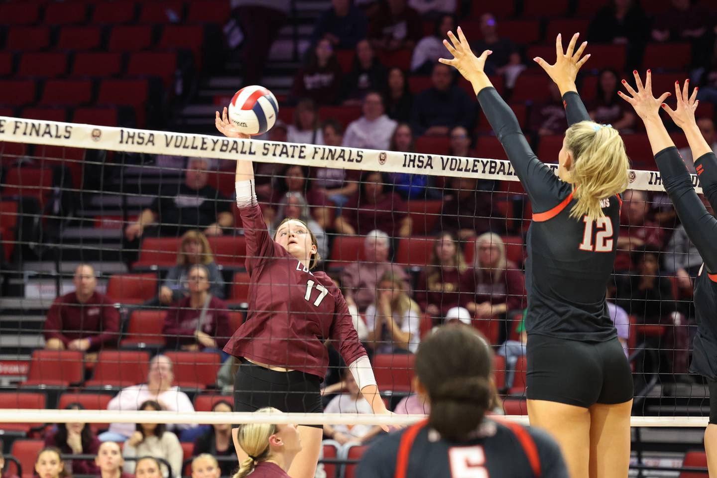 Lockport's Bridget Ferriter sends the ball over a Benet Academy block during Benet Academy's victory in two sets, 25-23, 25-16, over Lockport in the IHSA Class 4A State semifinals on Friday, Nov. 14, 2025.